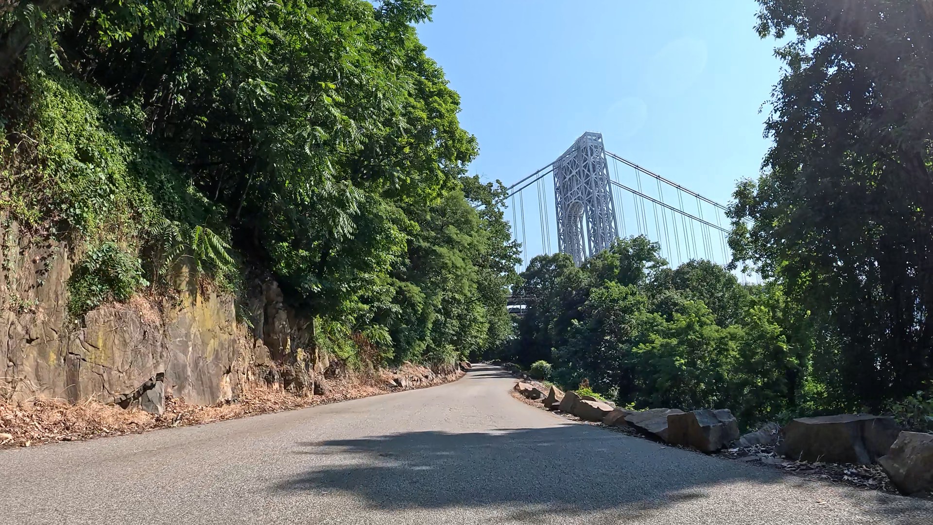Raw GoPro frame from the handlebar cam with no overlay: the road ahead and nothing else